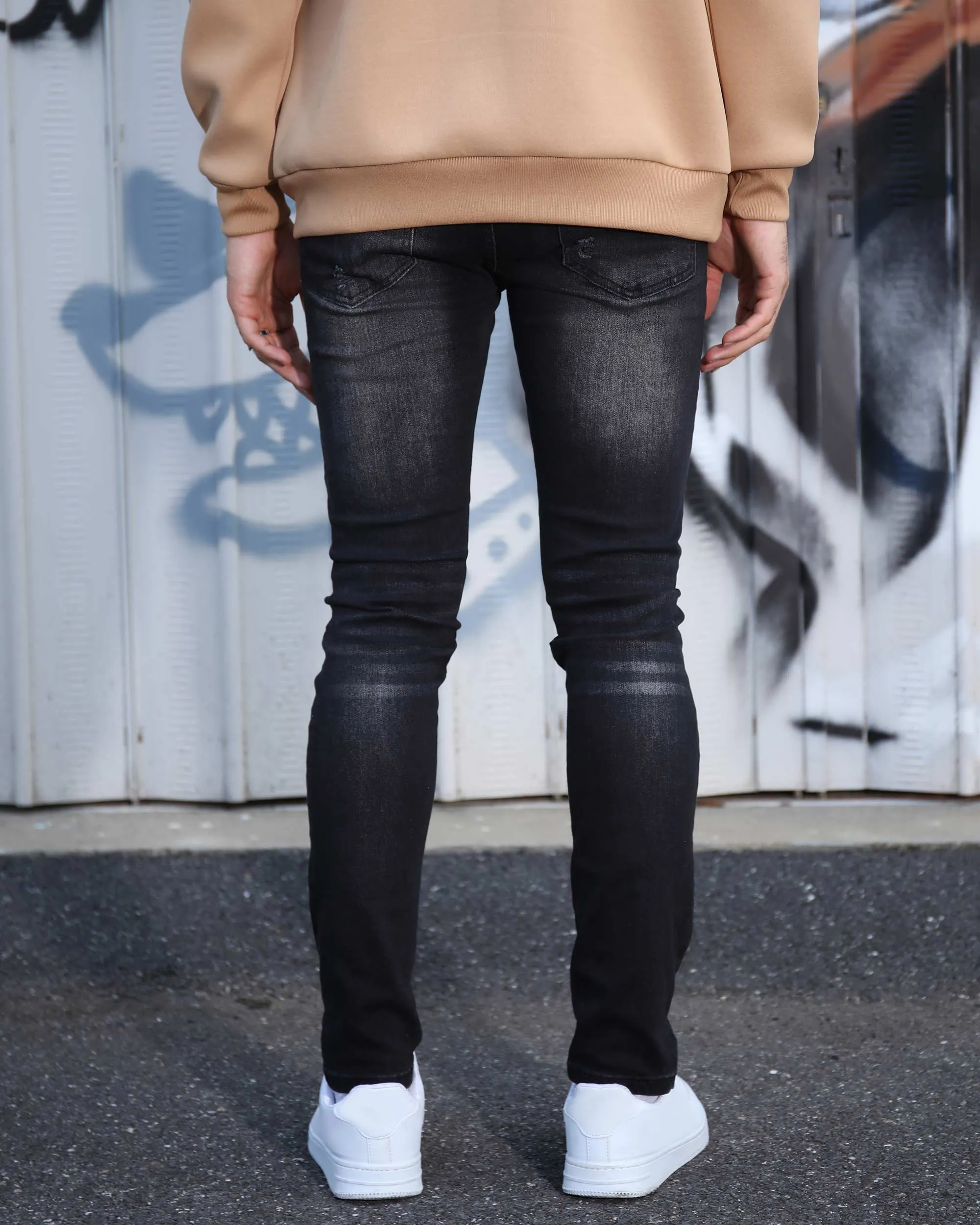 Black Ripped Jeans with Bold Rips and Plaid Patch