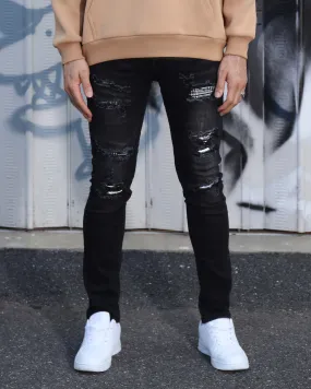 Black Ripped Jeans with Bold Rips and Plaid Patch
