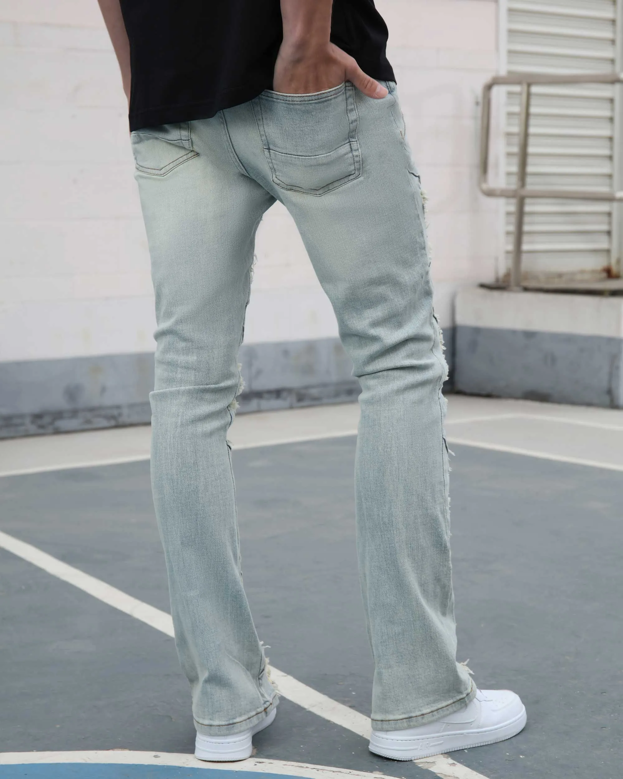 Distressed Flared Blue Jeans with Large Ripped