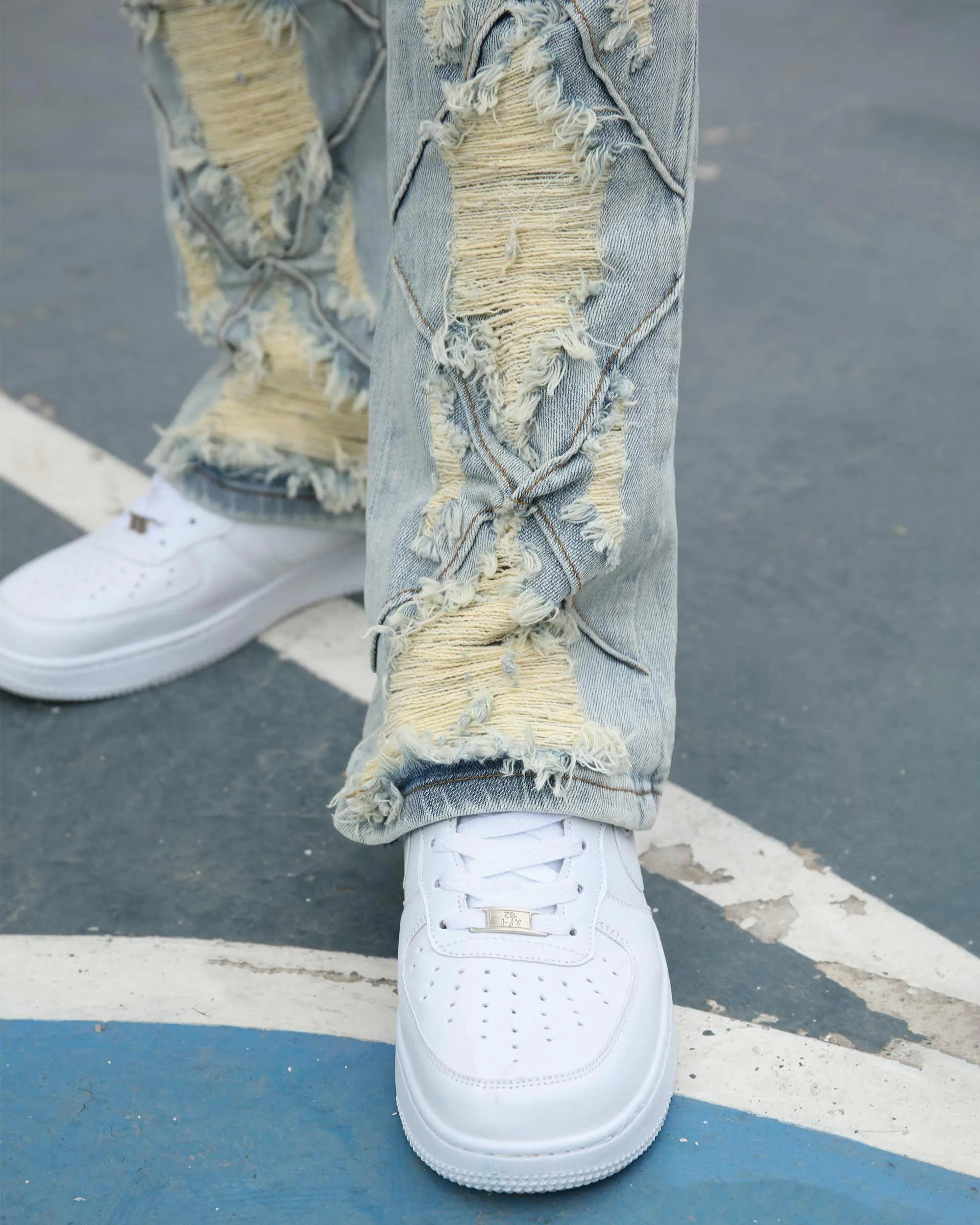 Distressed Flared Blue Jeans with Large Ripped
